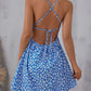 The cami dress with small flower prints a backless design and thin spaghetti straps is suitable for beach vacations and summer