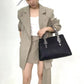 Ladies' fashionable camellia handbag with retro snake pattern handle splicing, single shoulder crossbody bag