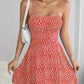 The cami dress with small flower prints a backless design and thin spaghetti straps is suitable for beach vacations and summer